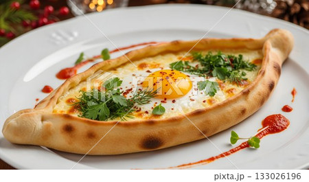 delicious baked georgian cheese bread adorned with sunny eggs and fresh herbs on rustic table 133026196