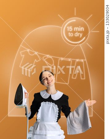 Creative collage. Smiling maid holding iron with drying clothes interface on orange background 133029034