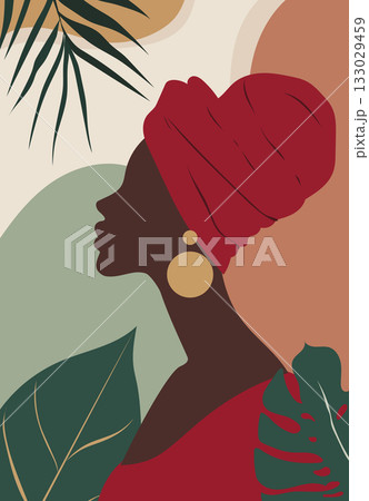 Profile of woman with red headwrap and golden earrings surrounded by tropical green leaves 133029459