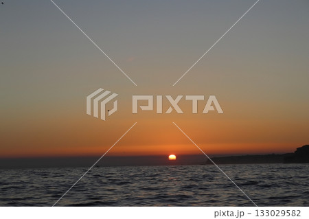 Golden Sunset Over Atlantic Ocean in Algarve, Portugal 133029582