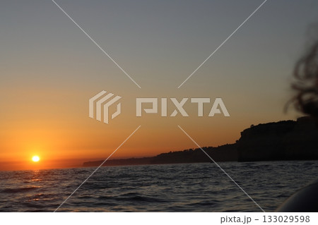 Golden Sunset Over Atlantic Ocean in Algarve, Portugal 133029598