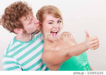 Loving couple girl holds thumb up gesture Loving couple girl holds thumb up gesture 133031225