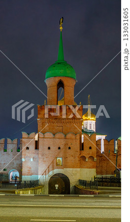The Odoevsky Gate Tower of the Tula Kremlin with bright night illumination. A majestic view of a historic monument of Russian defensive architecture against a dark sky in Tula, Russia. 133031605