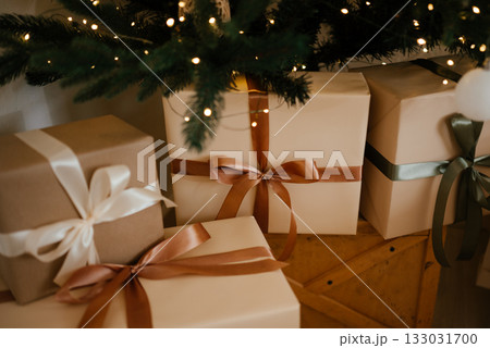 Christmas Gifts Under Festive Decorated Christmas Tree 133031700