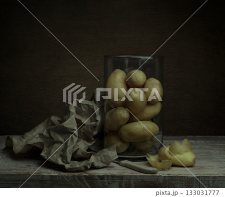 still life. organic raw potatoes peeled on the table still life. organic raw potatoes peeled on the table 133031777