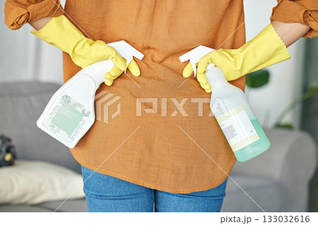 Woman hands, spray bottle or back for spring cleaning, housekeeping or hotel maintenance with healthcare product. Zoom, cleaner or tired maid and detergent, liquid or bacteria in hospitality service 133032616