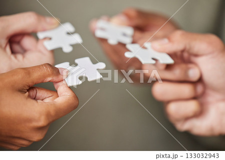 Business people, hands and puzzle piece for collaboration, planning or team building strategy at office. Hand of group in teamwork for goal, support or motivation in cooperation for problem solving 133032943