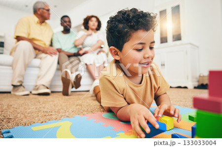 Family, happy and boy on floor with toys for playing, creative activity and having fun in living room. Education, child development and kid enjoy building blocks, games and relax with parents at home 133033004