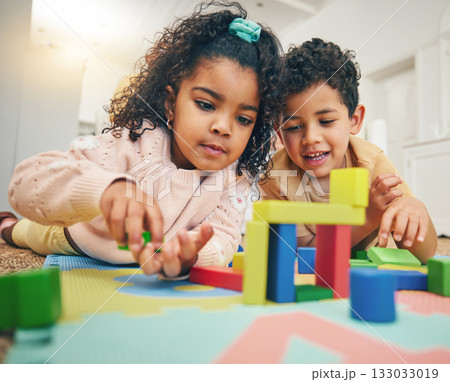 Building blocks, happy children and floor with toys for playing, bonding and educational games at home. Family, child development and boy and girl enjoy creative activity, learning and relaxing 133033019