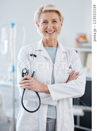 Portrait, woman and doctor with arms crossed, stethoscope and happiness in hospital, clinic and surgery. Mature female medical worker smile for healthcare services, cardiology wellness and experience Portrait, woman and doctor with arms crossed, stethoscope and happiness in hospital, clinic and surgery. Mature female medical worker smile for healthcare services, cardiology wellness and experience 133033194