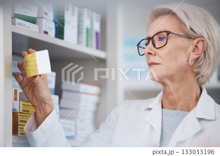 Pharmacist, pharmacy and woman reading side effects on medication label, pills or box in drugstore. Healthcare, wellness and medical doctor looking at medicine, antibiotics or drugs or vitamins Pharmacist, pharmacy and woman reading side effects on medication label, pills or box in drugstore. Healthcare, wellness and medical doctor looking at medicine, antibiotics or drugs or vitamins 133033196