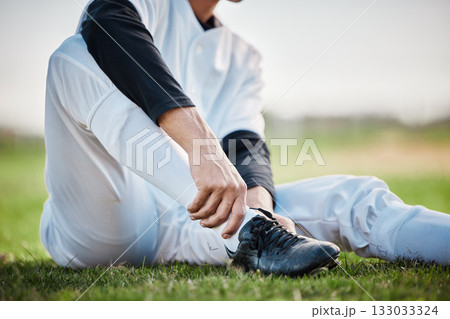 Baseball player, shoes and ankle pain, man with sport injury and emergency, first aid and need medical care outdoor. Accident, muscle tension and inflammation with male on sports field and fitness 133033324