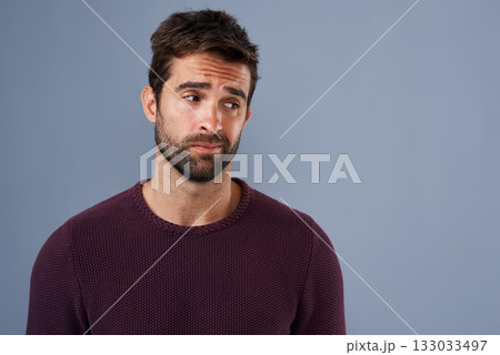 Doubt, thinking and face of man with unsure, uncertain and thoughtful on gray background in studio. Wonder mockup, advertising space and isolated male person worry for decision, choice and question 133033497