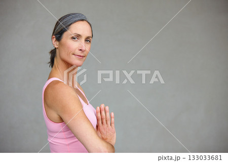 Yoga, portrait and elderly woman in praying pose in studio health, balance and exercise on wall background. Face, meditation and mature lady calm with zen for workout and training on space for mockup 133033681
