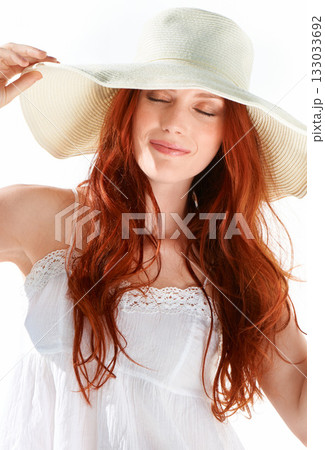 Happy woman, eyes closed and straw hat in studio, isolated white background and natural style. Face of calm female model with cool summer accessory, fashion and ginger beauty to relax with happiness 133033692