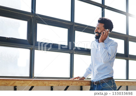 Window, smile and phone call with a business man thinking about the future success of his company in the office. Happy, mindset and communication with a male employee chatting on his mobile at work Window, smile and phone call with a business man thinking about the future success of his company in the office. Happy, mindset and communication with a male employee chatting on his mobile at work 133033698