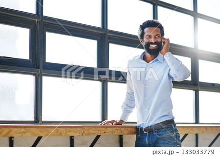 Window, phone call and communication with a happy business man in the office with a smile or mindset of the future. Happy, mobile and contact with a male employee talking at work during his break 133033779