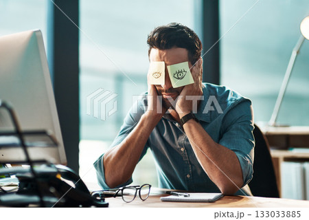 Tired, sleeping and a man with sticky note on face during overtime, late work and business at night. Fatigue, burnout and a businessman with paper to cover eyes during sleep at a desk for a deadline 133033885