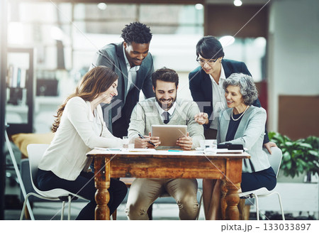 Tablet, happy or business people planning in meeting for team strategy or working on project in company. Online, digital news or employees smiling or talking in group discussion for growth in office 133033897