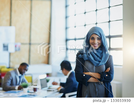 Muslim woman, business and portrait in an office with a smile and arms crossed for career pride. Arab female entrepreneur or leader at a diversity and corporate workplace with a positive mindset 133033930