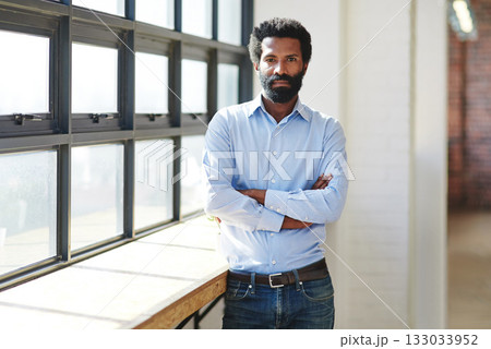 Portrait, window and a business man arms crossed in the office with a mindset of focus on future success. Serious, vision and corporate with a male employee standing in the workplace during his break Portrait, window and a business man arms crossed in the office with a mindset of focus on future success. Serious, vision and corporate with a male employee standing in the workplace during his break 133033952
