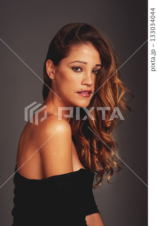 Beauty, face and portrait of woman in studio for hair care, fashion and healthy curls on grey background. Aesthetic female model person with facial skin glow, cosmetics and natural makeup style Beauty, face and portrait of woman in studio for hair care, fashion and healthy curls on grey background. Aesthetic female model person with facial skin glow, cosmetics and natural makeup style 133034044