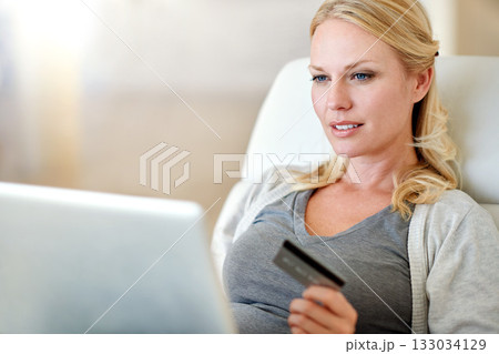 Woman, laptop and credit card for ecommerce, payment or electronic purchase in living room at home. Female person or shopper on computer for online shopping, bank app or internet banking at the house 133034129