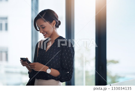 Business, smile or woman with a cellphone, connection or typing with social media, texting or sms in a workplace. Female person, employee or entrepreneur with a smartphone or search internet for info Business, smile or woman with a cellphone, connection or typing with social media, texting or sms in a workplace. Female person, employee or entrepreneur with a smartphone or search internet for info 133034135