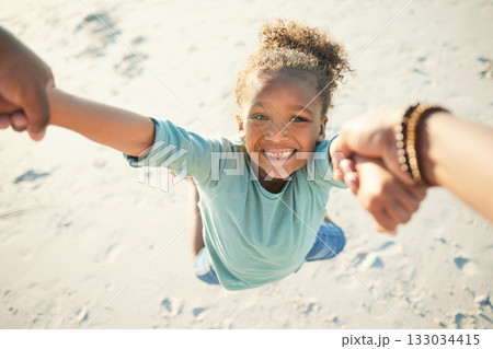 Pov, happy and father spinning child while at the beach on a summer vacation, adventure or weekend trip. Happiness, freedom and man swinging a girl kid on the sand while having fun on seaside holiday Pov, happy and father spinning child while at the beach on a summer vacation, adventure or weekend trip. Happiness, freedom and man swinging a girl kid on the sand while having fun on seaside holiday 133034415