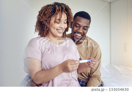 Couple with pregnancy test results, fertility and people having a baby, happy with love and care at home. Interracial, black man and pregnant woman, start family with new mother and father with smile 133034630