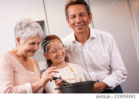 Portrait, happy girl or grandparents teaching cooking skills for healthy dinner with vegetables diet at home. Learning, young child helping or grandmother with old man, smile or food meal in kitchen Portrait, happy girl or grandparents teaching cooking skills for healthy dinner with vegetables diet at home. Learning, young child helping or grandmother with old man, smile or food meal in kitchen 133034841