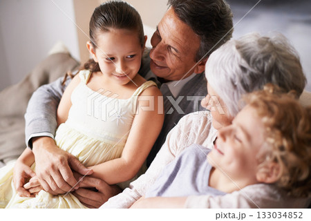 Smile, love or happy grandparents with children hug to embrace care together in family home in retirement. Elderly grandma, old man or kids siblings relaxing or bonding to enjoy quality time together 133034852