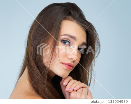 Makeup, beauty and portrait of woman in studio on blue background for wellness, skincare and facial treatment. Salon aesthetic, dermatology and face of girl with cosmetics, confidence and glowing Makeup, beauty and portrait of woman in studio on blue background for wellness, skincare and facial treatment. Salon aesthetic, dermatology and face of girl with cosmetics, confidence and glowing 133034989