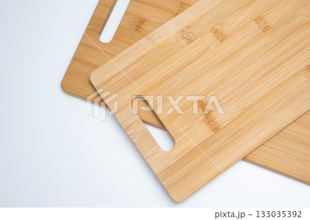 Two Bamboo Cutting Boards with Handles on White Two Bamboo Cutting Boards with Handles on White 133035392