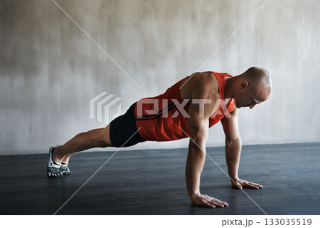 Workout, muscular and man doing push up for exercise, health performance and sports training for muscle building. Bodybuilding mockup, healthy gym body and strong person doing studio floor pushup 133035519