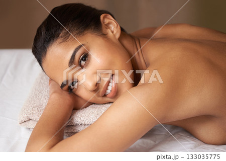 Portrait of woman, happy or massage to relax for zen resting or wellness physical therapy in spa hotel. Face of girl smiling in salon to exfoliate for body healing treatment or holistic detox therapy Portrait of woman, happy or massage to relax for zen resting or wellness physical therapy in spa hotel. Face of girl smiling in salon to exfoliate for body healing treatment or holistic detox therapy 133035775