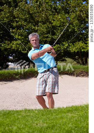 Sports, portrait and old man with golf club swing outdoor for fitness, training and practice. Face, golfing and senior male golfer swinging driver in a park, serious and enjoying retirement hobby 133035890
