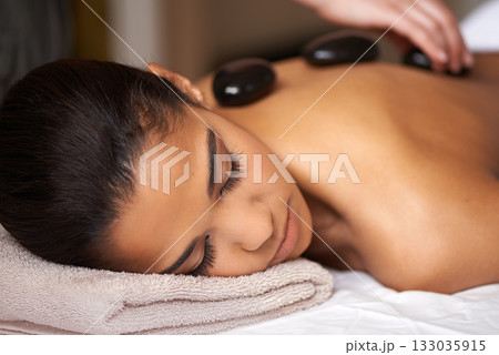 Woman, hands or back massage with rocks in spa to relax for zen, sleeping or wellness physical therapy. Girl, rest or calm client in salon to exfoliate for body healing treatment or hot stone therapy Woman, hands or back massage with rocks in spa to relax for zen, sleeping or wellness physical therapy. Girl, rest or calm client in salon to exfoliate for body healing treatment or hot stone therapy 133035915