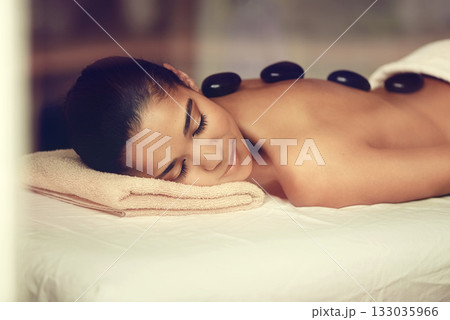Girl, rocks or back massage in spa to relax for zen resting, sleeping or wellness physical therapy hotel resort. Calm woman in salon to exfoliate for body healing treatment or hot stone detox therapy Girl, rocks or back massage in spa to relax for zen resting, sleeping or wellness physical therapy hotel resort. Calm woman in salon to exfoliate for body healing treatment or hot stone detox therapy 133035966