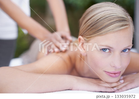 Face, woman in portrait and back massage at spa with holistic treatment and self care. Wellness, young female person relax at luxury resort with masseuse and physical therapy with healing and zen Face, woman in portrait and back massage at spa with holistic treatment and self care. Wellness, young female person relax at luxury resort with masseuse and physical therapy with healing and zen 133035972