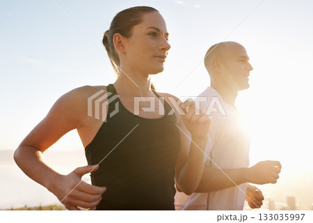 Sunrise, fitness and happy couple running as exercise, performance and morning workout for heath and wellness in nature. Sport, energy and people training for a marathon or sports health together Sunrise, fitness and happy couple running as exercise, performance and morning workout for heath and wellness in nature. Sport, energy and people training for a marathon or sports health together 133035997