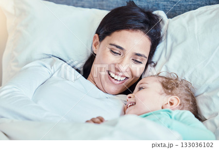 Love, baby and mother relax in bed, waking up and bonding, happy and smile together in their home. Rest, family and mom with child in a bedroom, laughing and sharing special moment of motherhood Love, baby and mother relax in bed, waking up and bonding, happy and smile together in their home. Rest, family and mom with child in a bedroom, laughing and sharing special moment of motherhood 133036102