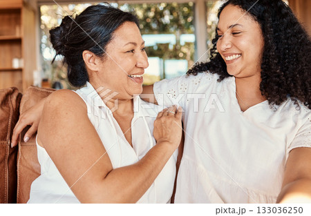 Woman, senior mother and smile of family on a living room sofa with happiness and bonding. Mama love, support and happy elderly care with women on a lounge couch in a house together with a hug 133036250