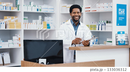 Pharmacist, portrait or black man writing on clipboard for medicine check, retail or medical prescription in drugstore. Smile, happy or pharmacy worker on paper documents for pills checklist or order 133036312