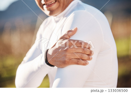 Hand, shoulder and injury with a runner man outdoor for cardio or endurance exercise in nature. Pain, arm and emergency with a male athlete suffering from cramp after an accident while running Hand, shoulder and injury with a runner man outdoor for cardio or endurance exercise in nature. Pain, arm and emergency with a male athlete suffering from cramp after an accident while running 133036500