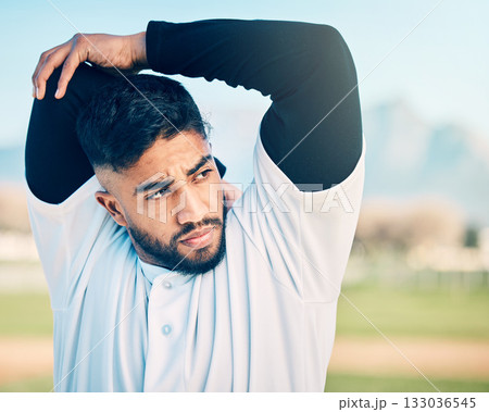 Stretching, sports and man thinking at a baseball game for focus, motivation and training idea. Fitness, exercise and athlete with an arm warm up ready to start a competitive match on a field Stretching, sports and man thinking at a baseball game for focus, motivation and training idea. Fitness, exercise and athlete with an arm warm up ready to start a competitive match on a field 133036545