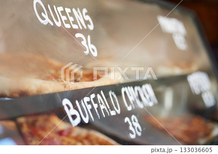 Shop display, pizza and fast food price, service and take away restaurant with closeup, storefront and window. Dinner, nutrition at cafe or bakery, lunch or dinner with to go meal option in New York Shop display, pizza and fast food price, service and take away restaurant with closeup, storefront and window. Dinner, nutrition at cafe or bakery, lunch or dinner with to go meal option in New York 133036605