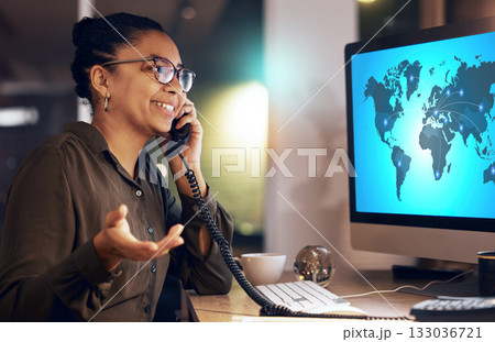 Black woman, computer and call center with telephone for global communication at night by office desk. African American female consultant or agent working late in conversation on phone with PC screen Black woman, computer and call center with telephone for global communication at night by office desk. African American female consultant or agent working late in conversation on phone with PC screen 133036721