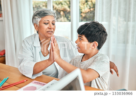 Learning, high five and child knowledge development at home with grandparent teacher. Teaching, elderly woman help and homework achievement hand gesture of a senior person and kid at a house Learning, high five and child knowledge development at home with grandparent teacher. Teaching, elderly woman help and homework achievement hand gesture of a senior person and kid at a house 133036966