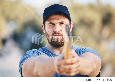 Target, focus and axe throwing with man in nature and aim for sports, training and tomahawk skills. Exercise, goal and hunting with athlete and hatchet in range for bullseye, ready and competition 133037100